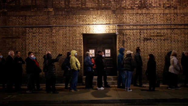 People wait in line for the Gordon Lightfoot concert at the newly re-opened Massey Hall in Toronto, Thursday, Nov. 25, 2021. THE CANADIAN PRESS/Cole Burston 