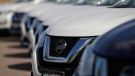 FILE - In this Aug. 25, 2019, file photo, unsold Rogue sports-utility vehicles sit at a Nissan dealership in Highlands Ranch, Colo. (AP Photo/David Zalubowski, File)