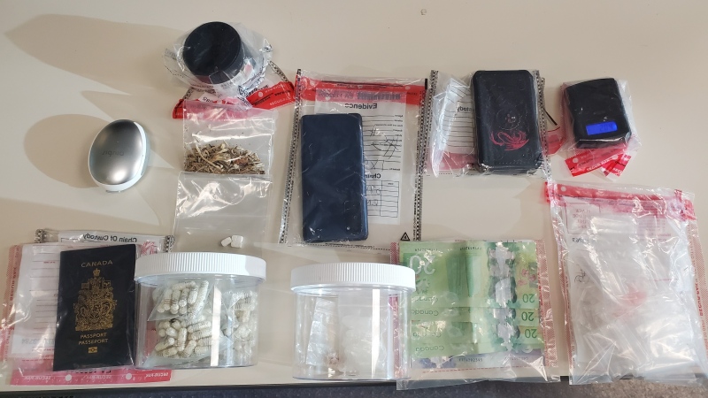 Suspected drugs, currency and stolen identity document seized by police at a Kitchener motel. (Submitted/Waterloo Regional Police Service)