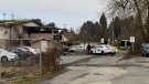 Investigators at a Richmond, B.C., home on Garden City Road on Jan. 26, 2022. (Regan Hasegawa/CTV)