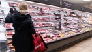 FILE - A customer shops at a meat counter in a grocery store in Montreal, on Thursday, April 30, 2020. THE CANADIAN PRESS/Paul Chiasson