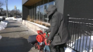 A homeless man pushes his cart of belongings on a cold winter day in Barrie, Ont. (ROB COOPER/CTV NEWS)