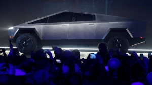 The Tesla Cybertruck is unveiled at Tesla's design studio Thursday, Nov. 21, 2019, in Hawthorne, Calif. CEO Elon Musk is taking on the workhorse heavy pickup truck market with his latest electric vehicle. (AP Photo/Ringo H.W. Chiu) 