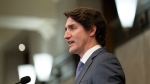 Canadian Prime Minister Justin Trudeau speaks following a cabinet retreat, Wednesday, Jan. 26, 2022 in Ottawa. Trudeau says Canada is extending its mission to train Ukrainian soldiers by three years. THE CANADIAN PRESS/Adrian Wyld 