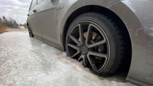 A Calgary woman says her son's car is trapped in a sheet of ice, which is being fed by a leaking pipe.
