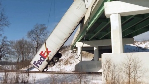 FedEx truck dangles over overpass in Indiana