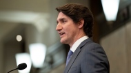 Canadian Prime Minister Justin Trudeau speaks following a cabinet retreat, Wednesday, Jan. 26, 2022 in Ottawa. Trudeau says Canada is extending its mission to train Ukrainian soldiers by three years. THE CANADIAN PRESS/Adrian Wyld 