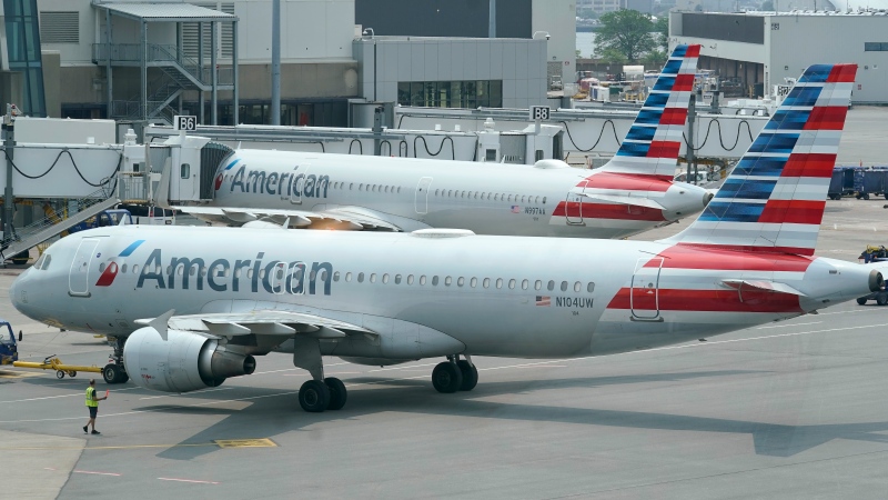 American Airlines passenger jets prepare for departure, Wednesday, July 21, 2021, near a terminal at Boston Logan International Airport, in Boston. (AP Photo/Steven Senne, File) 