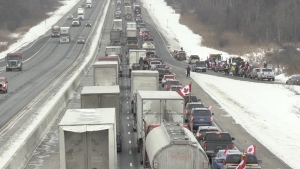 The 'Freedom Convoy' of trucks passes through London, Ont. on Highway 401, Thursday, Jan. 27, 2022. (Jim Knight / CTV News)