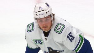 A former player with the Vancouver Canucks has been charged with sexual assault. 