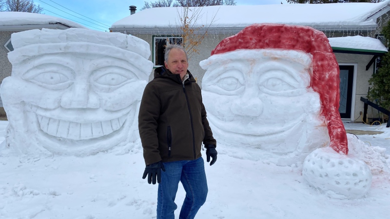 Bron Nurkowski created two giant heads out of snow on his front lawn in Lakeview, Regina. (Gareth Dillistone/CTV News) 