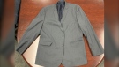 Police in New Westminster are looking for someone who recently donated a grey suit jacket to a thrift store, after "items of significant value" were found inside the pocket. (NWPD)
