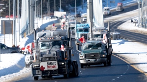 Protesters and supporters drive over the Nipigon Bridge on the Trans Canada Highway as part of a trucking convoy against COVID-19 vaccine mandates in Nipigon, Ont., on Thursday, Jan. 27, 2022. THE CANADIAN PRESS/David Jackson 