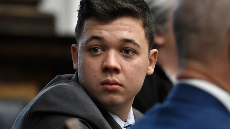 Kyle Rittenhouse looks back as attorneys discuss items in the motion for mistrial presented by his defence at the Kenosha County Courthouse in Kenosha, Wis., on Nov. 17, 2021. (Sean Krajacic/The Kenosha News via AP, Pool)