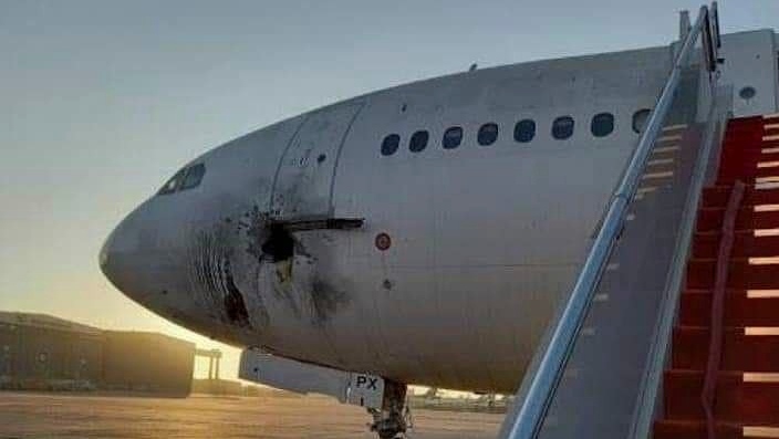 This photo from the media Office of the Ministry of Transport shows a damaged aircraft on the tarmac of Baghdad airport, after a rocket attack in Baghdad, Iraq, Friday, Jan. 28, 2022.  (The Ministry of Transport media Office via AP) 
