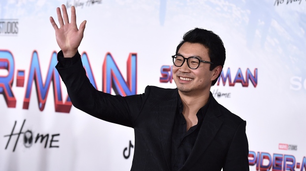 Simu Liu arrives at the premiere of "Spider-Man: No Way Home" at the Regency Village Theater on Monday, Dec. 13, 2021, in Los Angeles. (Photo by Jordan Strauss/Invision/AP) 
