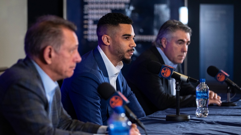 Edmonton Oilers General Manager Ken Holland, left, Evander Kane and Head Coach Dave Tippet announce Kane's signing in Edmonton, Friday, Jan. 28, 2022. THE CANADIAN PRESS/Jason Franson 