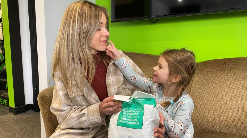 Erika Tkatchuk, owner of Lil Mak Diaper Company, chats with her two-year-old daughter Lucy, who is wearing a Lil Mak diaper. (Gareth DillistoneCTVRegina)  