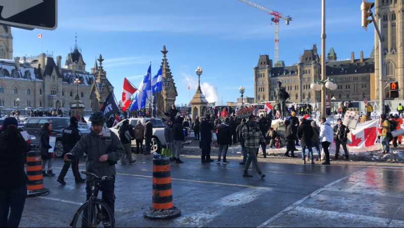 Protesters gather on Parliament Hill as a trucker convoy arrives in Ottawa on Friday, Jan. 28, 2022. (Nate Vandermeer/CTV News Ottawa)