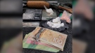 OPP say they seized drugs, cash and a shotgun in a raid on a Prescott, Ont. home that led to six arrests. (OPP)