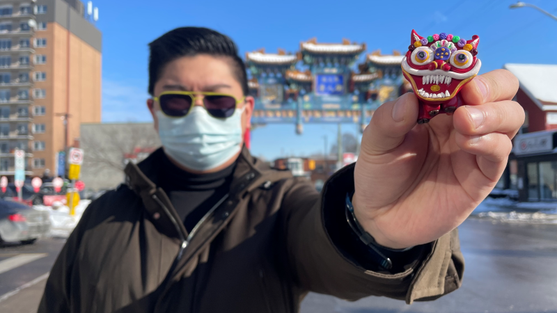 Eric Chan, of the Ottawa Chinatown BIA, holds one of the art pieces that will be hidden for a scavenger hunt to celebrate the Lunar New Year. (Peter Szperling/CTV News Ottawa)