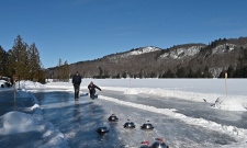 Tossing homemade curling stones down the frozen Gatineau River. (Joel Haslam/CTV News Ottawa)