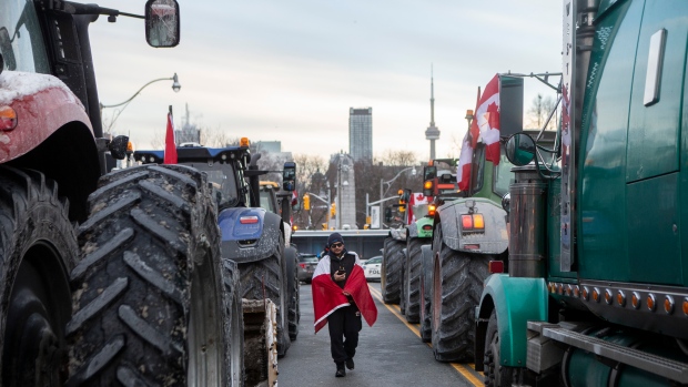 Toronto trucker convoy protest begins with tractors as police bolster hospitals