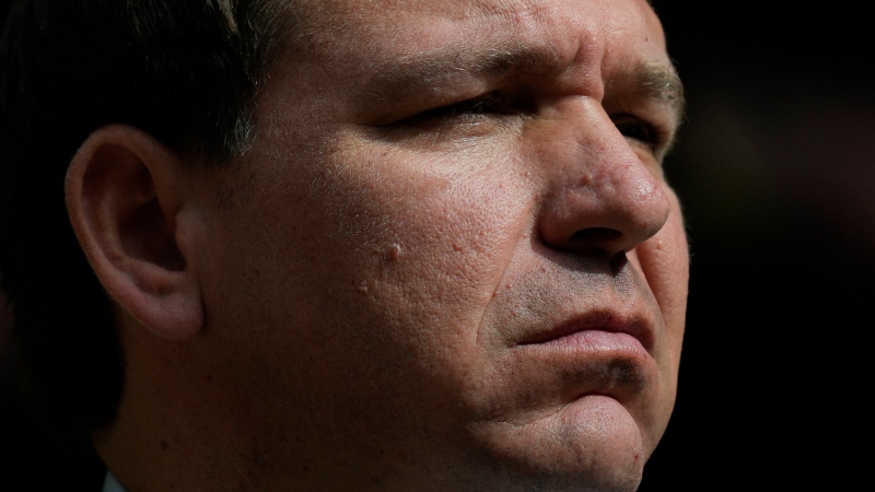 Florida Gov. Ron DeSantis listens during a news conference at Vizcaya Museum and Gardens, Tuesday, Feb. 1, 2022, in Miami. (AP Photo/Rebecca Blackwell) 