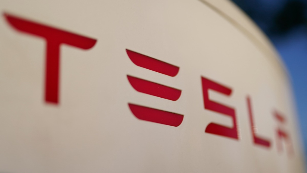 Tesla logo on a Tesla Supercharger station