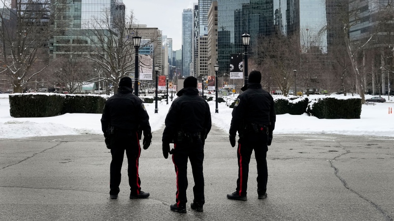 Legislature Protective Service members guard the perimeter as police and city staff prepare for a convoy protesting public health measures taken to curb the spread of COVID-19 at Queen's Park this coming weekend, in Toronto, Friday, Feb. 4, 2022. THE CANADIAN PRESS/Nathan Denette