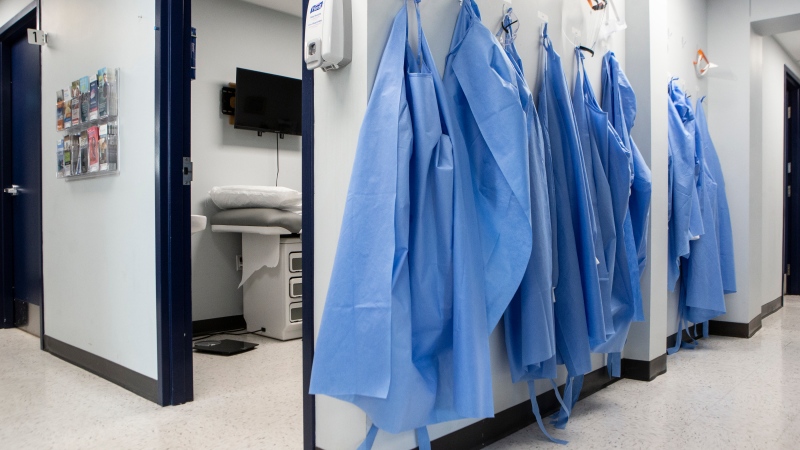 Healthcare workers' personal protective equipment hangs at a clinic in Sarnia, Ont., on Wednesday, January 26, 2022.THE CANADIAN PRESS/Chris Young