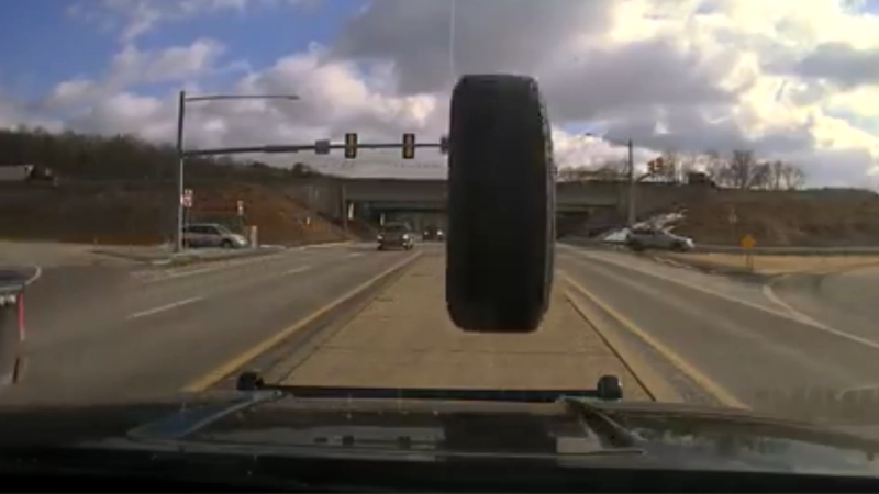 Pennsylvania officers were caught by surprise when a pickup truck lost a tire that struck their police cruiser's windshield.