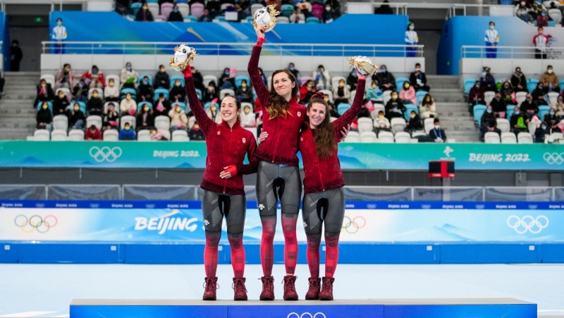 Team Canada long track speed skaters Valerie Maltais, Isabelle Weidemann and Ivanie Blondin celebrate their gold medal and Olympic record in the women’s team pursuit during the Beijing 2022 Olympic Winter Games in Beijing, China on Tuesday, February 15, 2022. (THE CANADIAN PRESS/HO, COC, Andrew Lahodynskyj)
