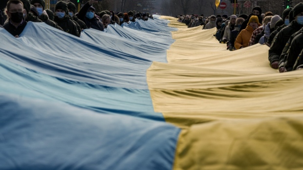 'We fear no one:' Ukrainians raise flags to defy Russia invasion fear