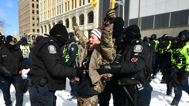 Police make at least 70 arrests in Ottawa, accuse protesters of assaulting officers