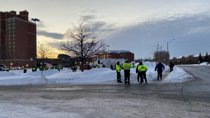 Police move in to clear demonstrators from the parking lot of the Ottawa Baseball Stadium on Coventry Road Sunday evening. (Colton Praill/CTV News Ottawa)