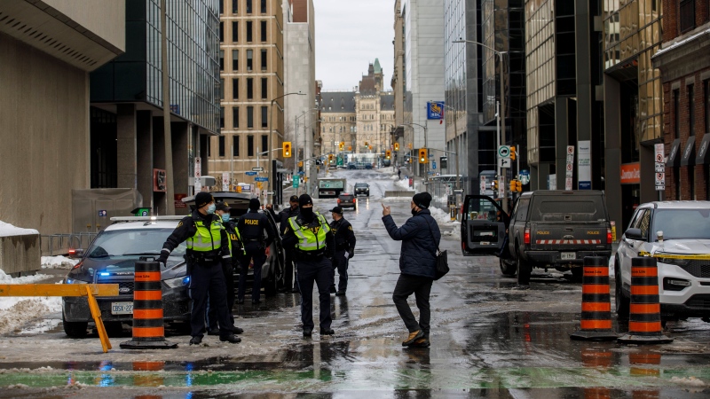 Police work checkpoints in Ottawa on Monday, Feb. 21, 2022, after officers cleared a trucker protest that was aimed at COVID-19 measures before growing into a broader anti-government protest that occupied the nation capital’s downtown core. (Cole Burston/THE CANADIAN PRESS)