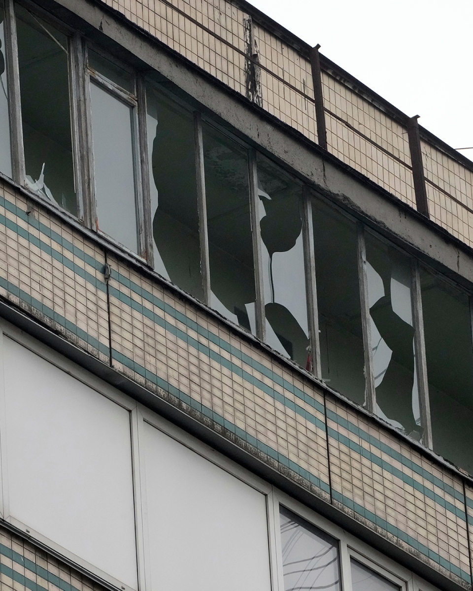 Broken windows are seen after Russian shelling