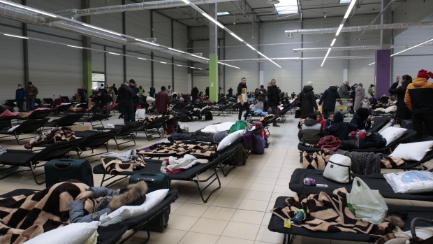 Displaced by war, tens of thousands of Ukrainians take shelter in Poland