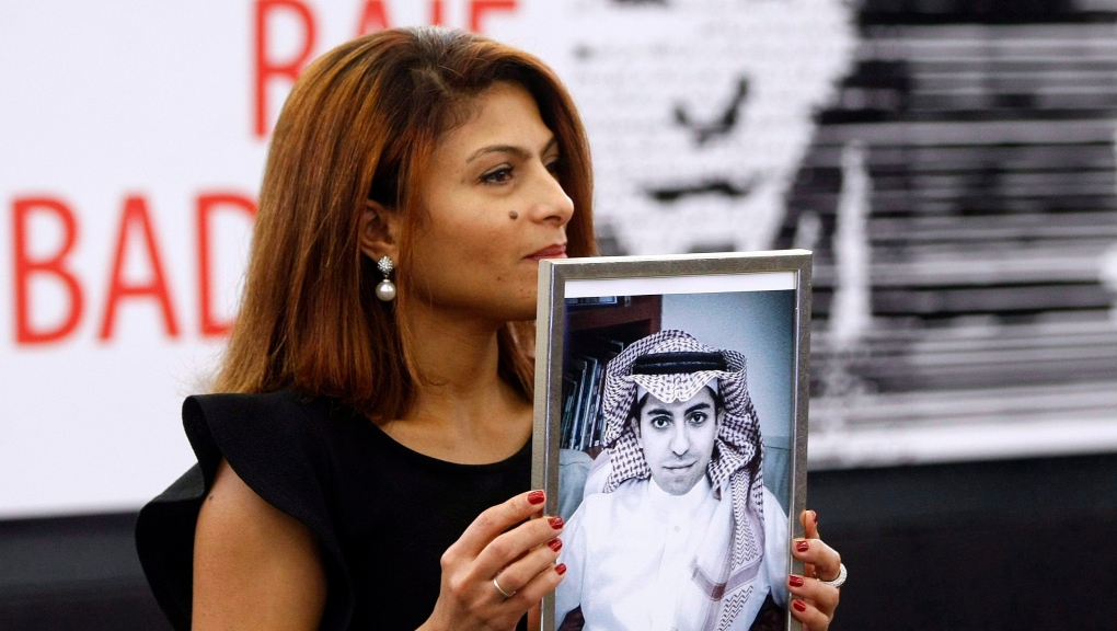 Ensaf Haidar with picture of Raif Badawi