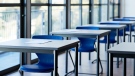 Desks are shown in a stock photo of an empty classroom. (Getty Images)
