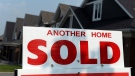 A for sale sign displays a sold home in a development in Ottawa on Monday, July 6, 2015. THE CANADIAN PRESS/Sean Kilpatrick