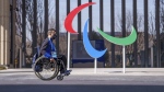 Italy's Matteo Remotti Martini moves in front of the Agitos outside the Paralympic Village ahead of the Beijing 2022 Winter Paralympic Games in Beijing, China, on March 3, 2022. (Thomas Lovelock/OIS via AP)