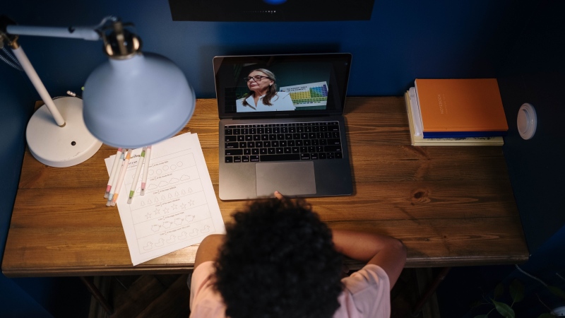 A child attends an online class in this stock photo. (Pexels)
