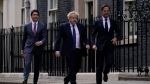Britain's Prime Minister Boris Johnson, centre, with Canadian Prime Minster Justin Trudeau, left, and Netherlands Prime Minister Mark Rutte walk from 10 Downing Street on Monday, March 7, 2022. (AP Photo/Alberto Pezzali, Pool)