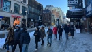 Shoppers walk on Ste. Catherine St. in Montreal. (Daniel J. Rowe/CTV News)