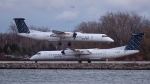 A Porter Airlines plane lands next to a taxiing plane at Toronto's Island Airport on Friday, November 13, 2015. THE CANADIAN PRESS/Chris Young