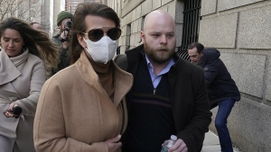 Juror No. 50, right, from the Ghislaine Maxwell trial, leaves federal court, in New York on March 8, 2022. (AP Photo/Richard Drew)