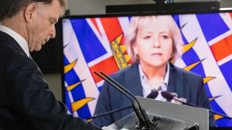 B.C. Health Minister Adrian Dix and Dr. Bonnie Henry, provincial health officer, provide an update on COVID-19 on January 14, 2022. (Province of British Columbia)