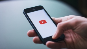 Undated photo of a person opening the YouTube app (Photo by freestocks.org from Pexels)